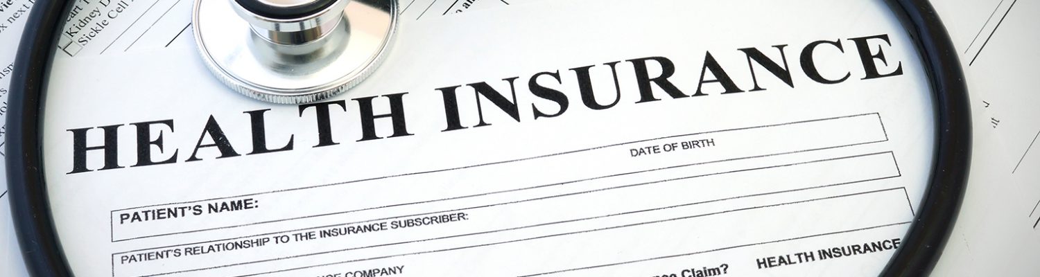 Health insurance form with stethoscope